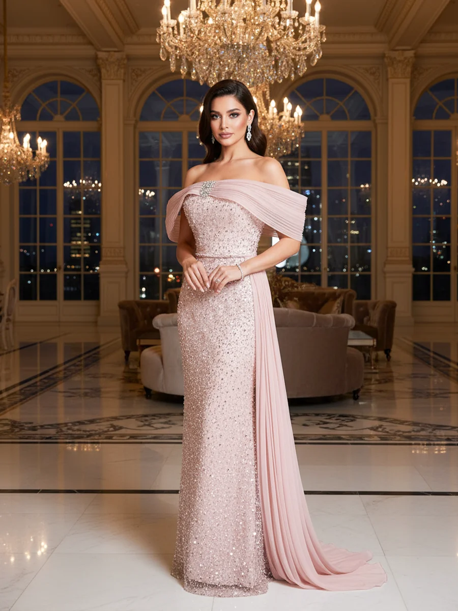 فستان سهرة وردي فاتح بتصميم تول فخم وانسيابي